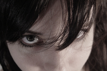 Moody Emotive Young Woman with Bangs