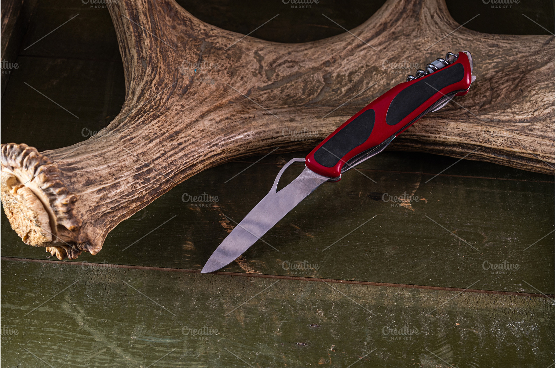 Folding pocket knife with red handle, an Industrial Photo by Stockphoto by vzwer