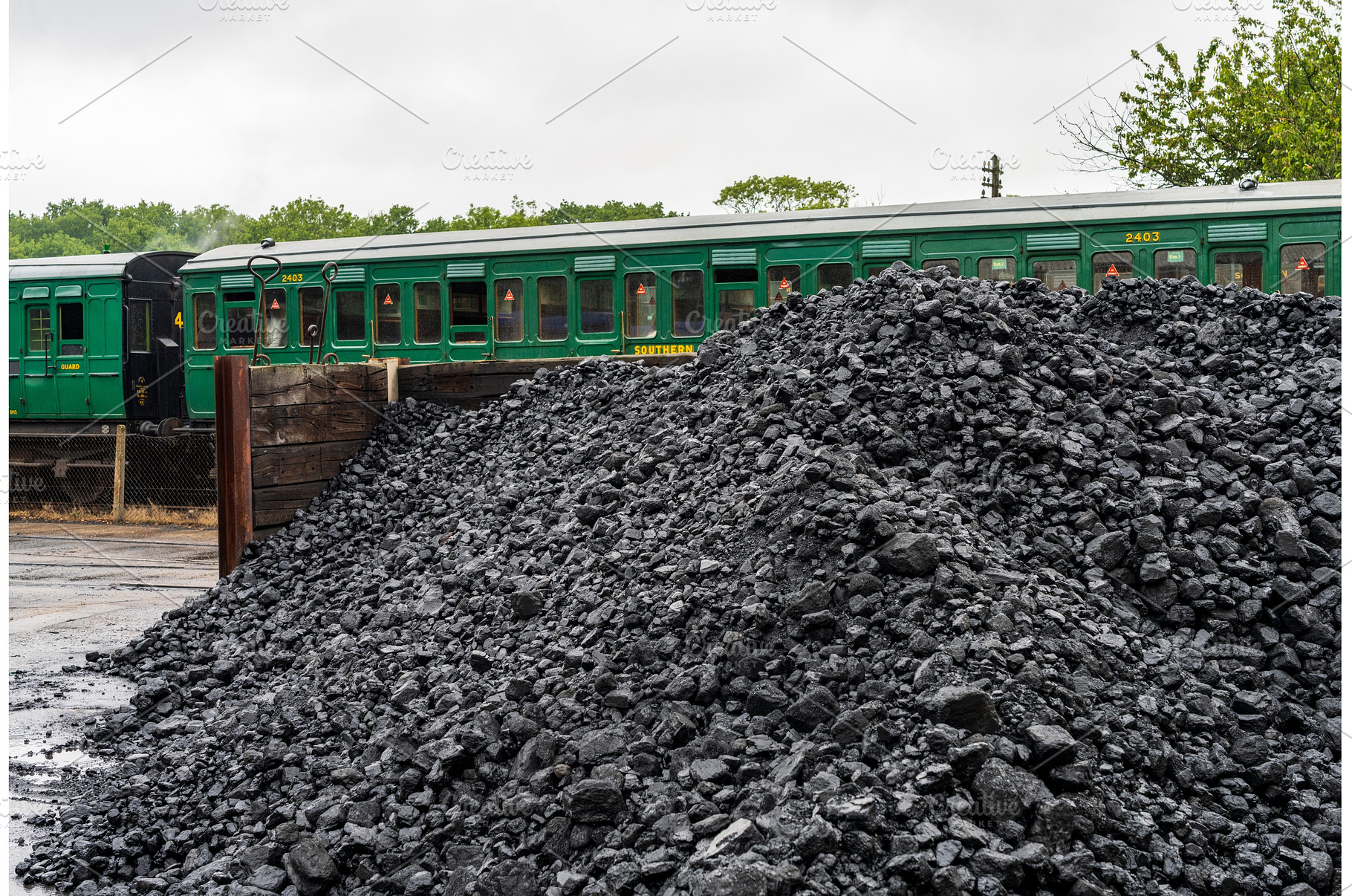 Stack of coal for the locomotives on, a Transportation Photo by Backyard Stock