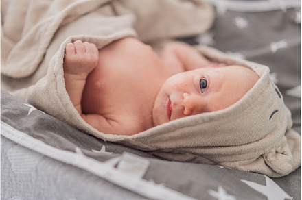 Baby after shower wrapped in a towel, a Person Photo by Elizaveta Galitskaya