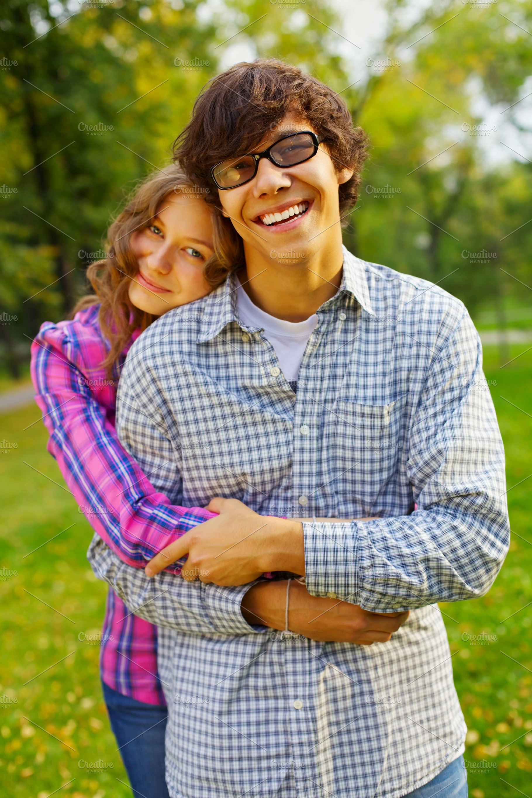 Happy teen couple in park, a Person Photo by Sergey Furtaev