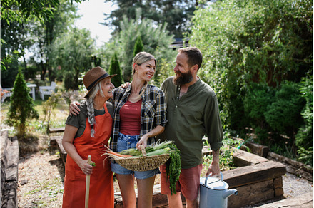 Happy farmer family holding their, a Person Photo by HalfPoint