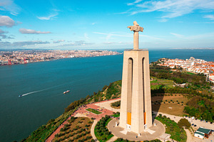 Sanctuary of Christ the King statue with city Almada and Tagus River, a Photo by andreonegin market