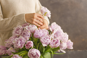 Florist at work: girl making bouquet