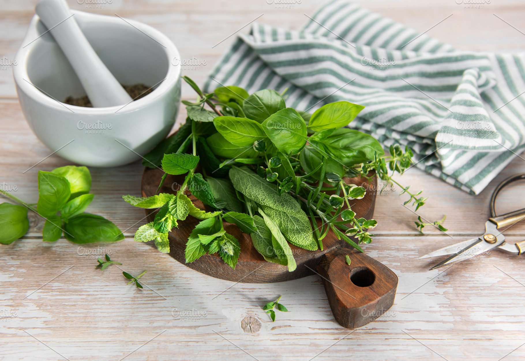 Fresh herbs for cooking with mortar and pestle, a Food & Drink Photo by Olena Rudo
