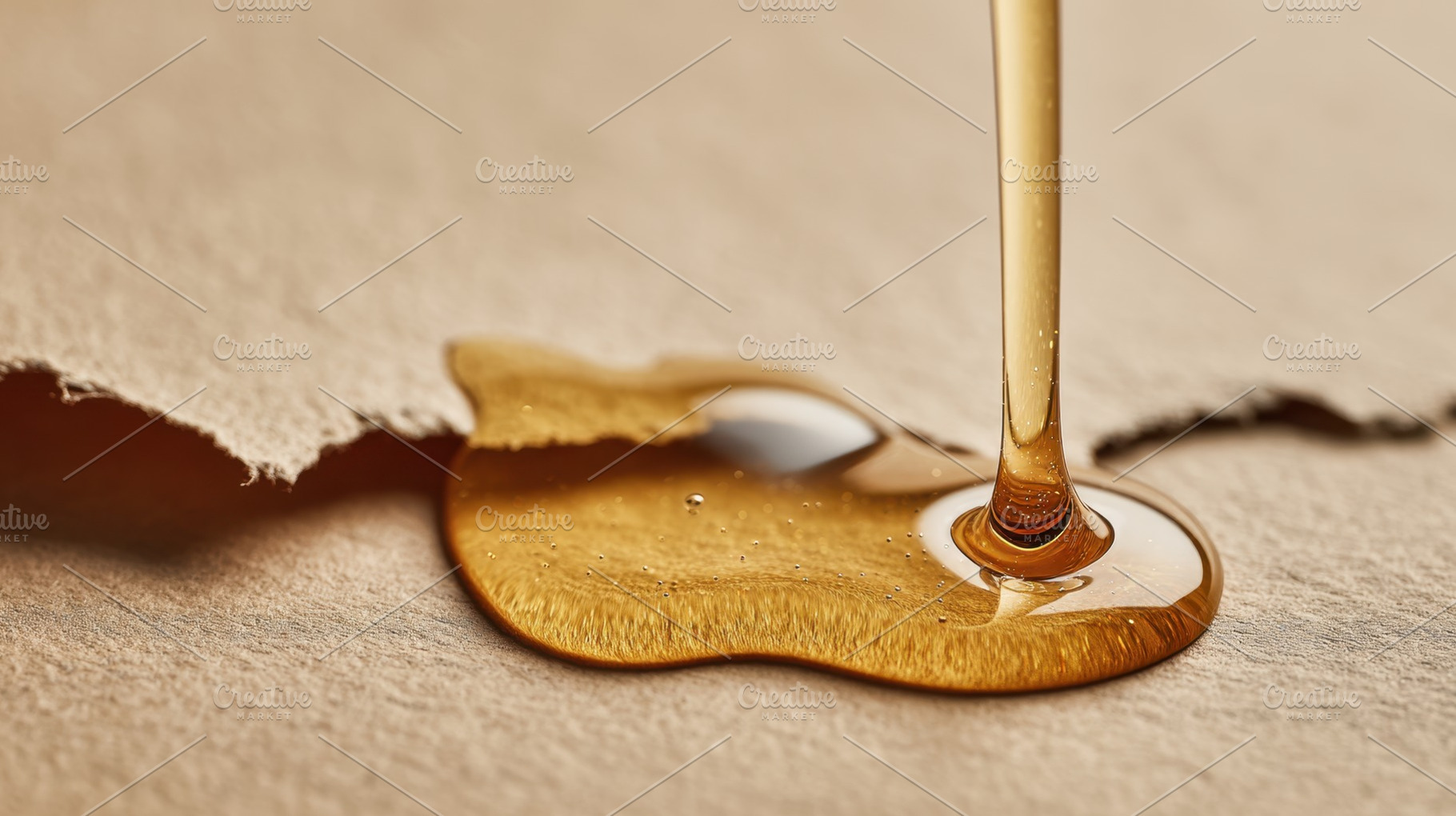 Honey dripping on brown paper, a Photo by Beautiful things