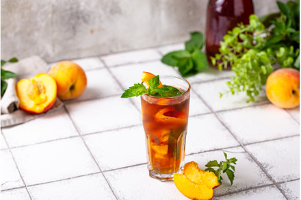 Cold ice tea with peach and mint, a Food & Drink Photo by Yulia Furman