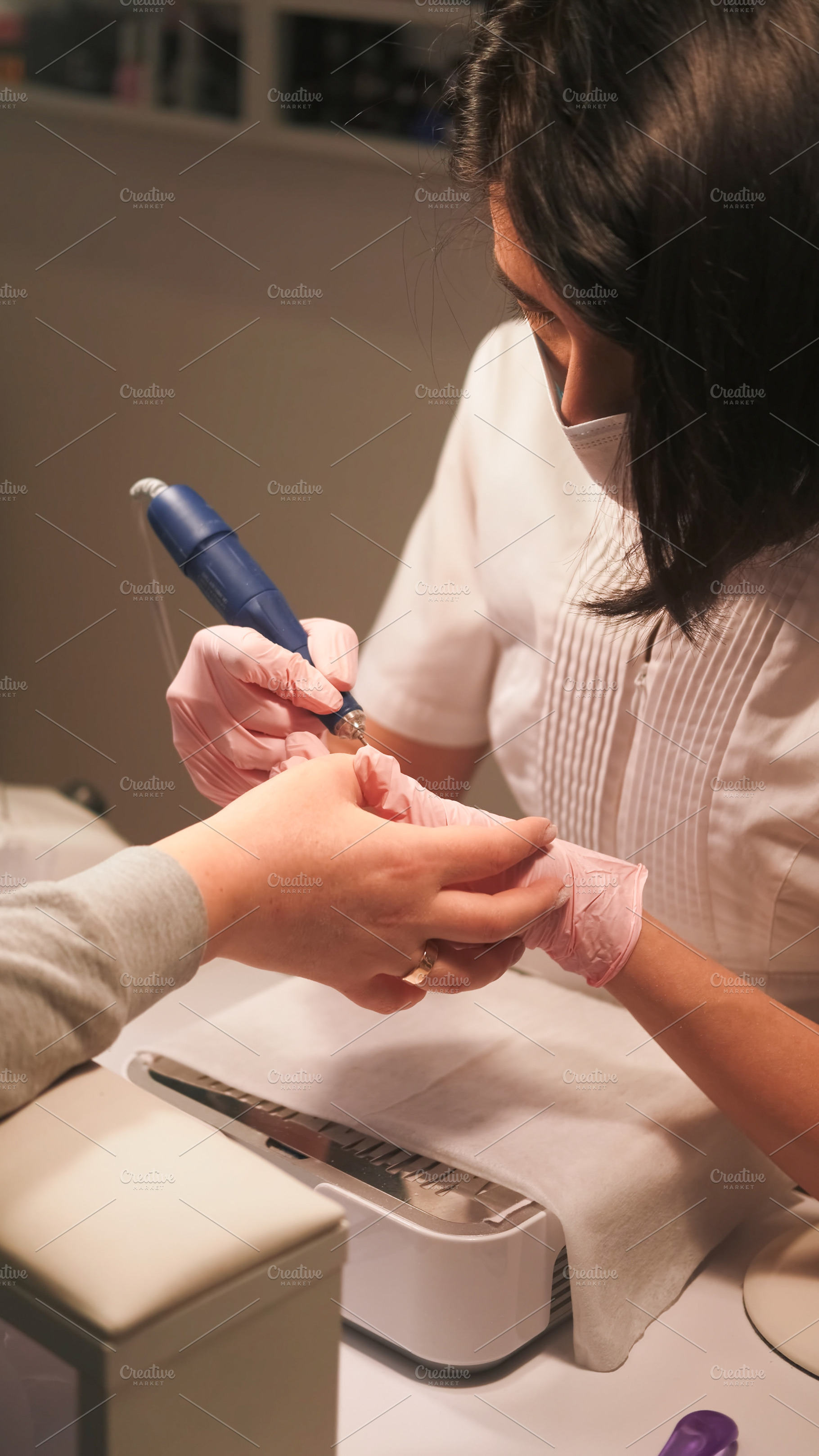 Manicure technique nail treatment hand cuticle, a Person Photo by Photo Drive Studio
