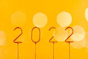 2022 golden numbers on yellow bokeh