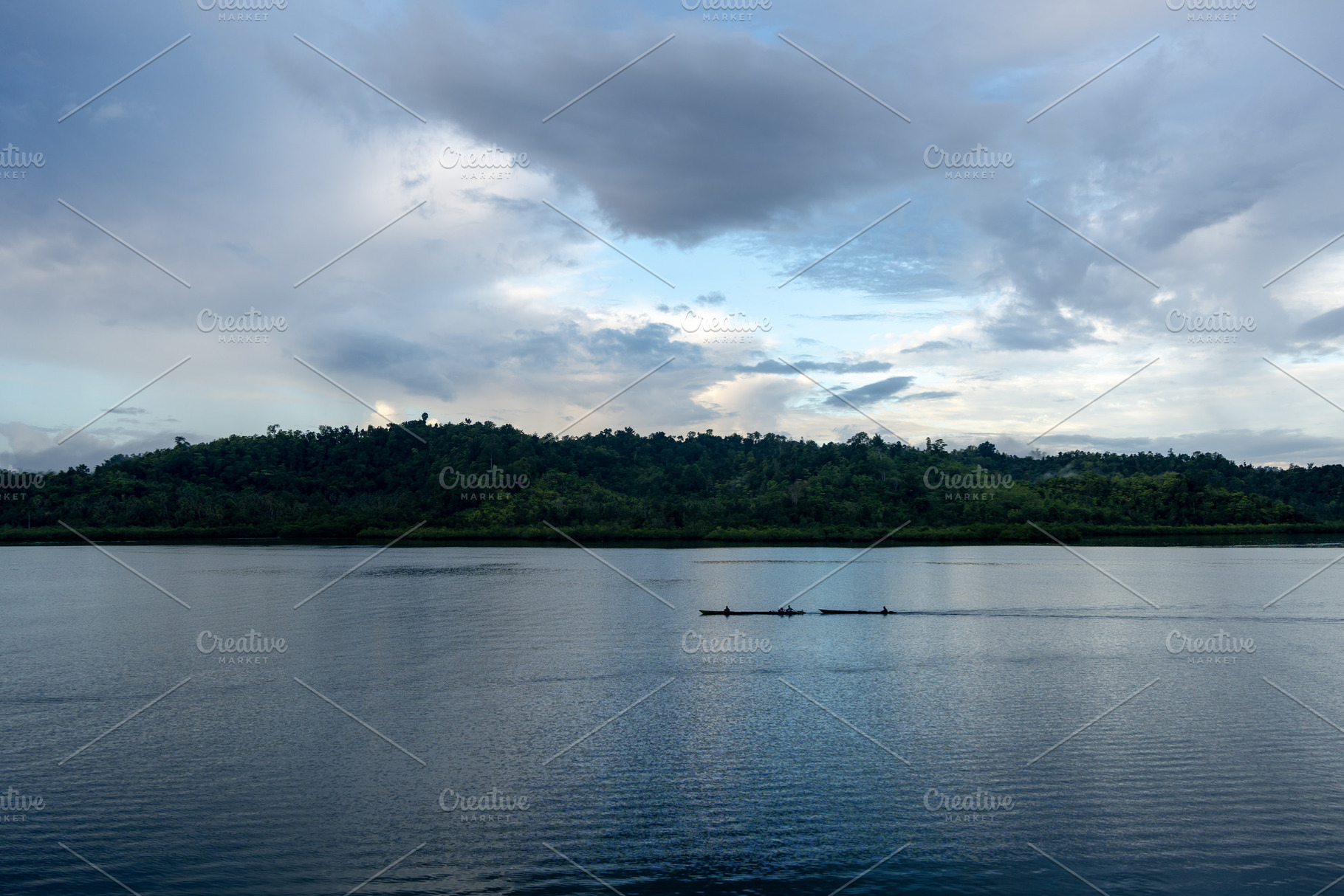 Sunset canoe ride in the Togian Islands, Sulawesi, Indonesia, a Nature Photo by GoodGoods