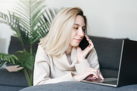 Young woman working on laptop in  home, a Person Photo by Olena Rudo