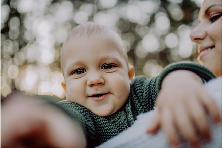 Close-up of mother holding her, a Nature Photo by HalfPoint