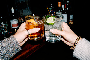 close view of a toast between two women, generative AI, a Photo by Nito