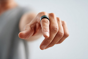 AI ring displayed prominently on palm with minimalist backdrop capturing modern, a Photo by AlyaAnd
