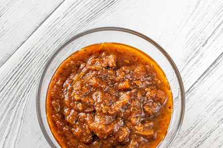 Bowl of puttanesca sauce, a Food & Drink Photo by Alexander Prokopenko