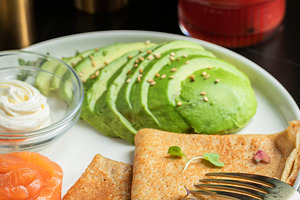 Roasted thin pancakes with smoked salmon and sauce