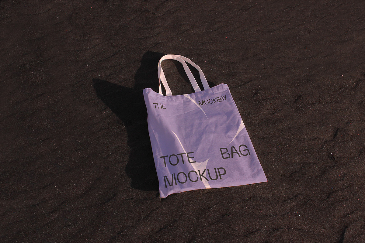 White Canvas Tote Bag Mockup Beach, a Mockup by TheMockeryShop