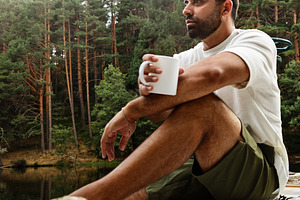 Man drinking coffee in nature, a Person Photo by Perpis