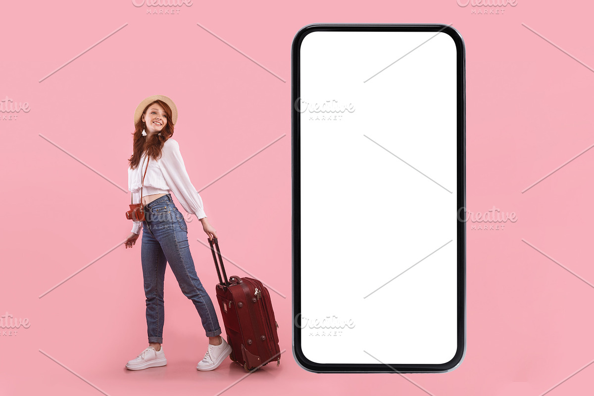 Female Tourist Near Phone Screen Posing With Suitcase, Pink Background, a Photo by Prostock-Studio (Photo 4 of 4)