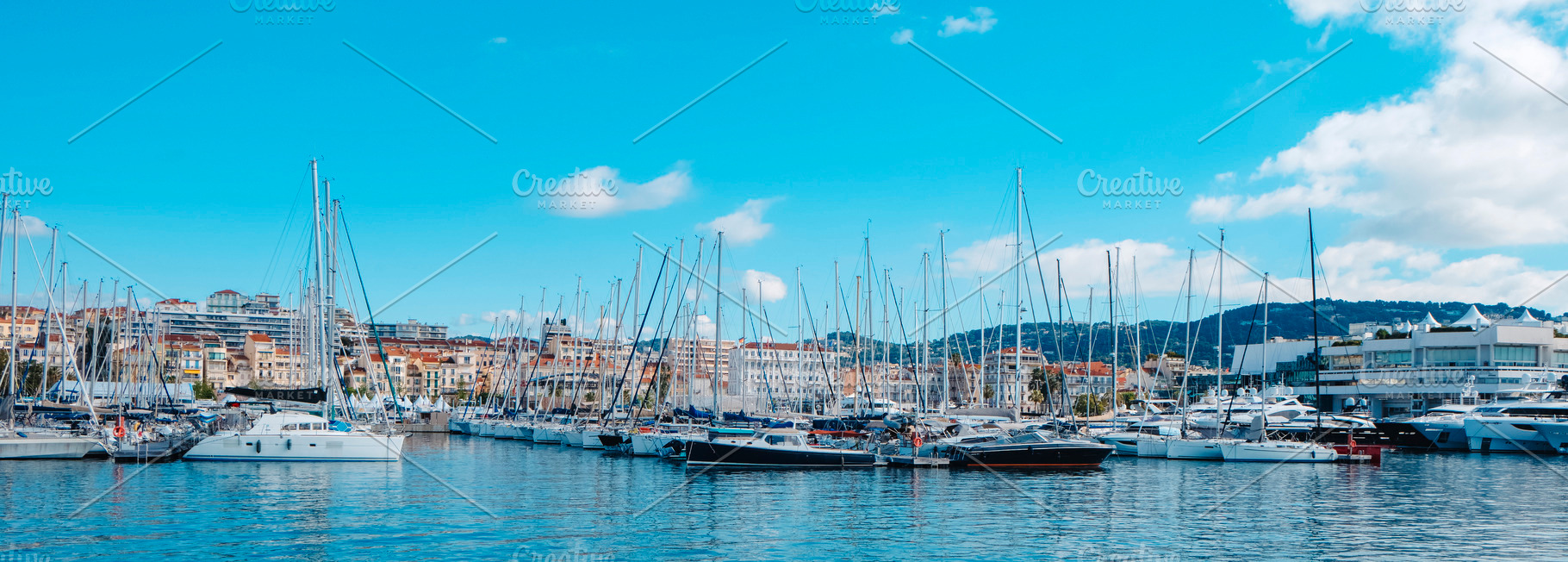 panoramic view of Cannes Vieux Port from the sea, a Photo by Nito
