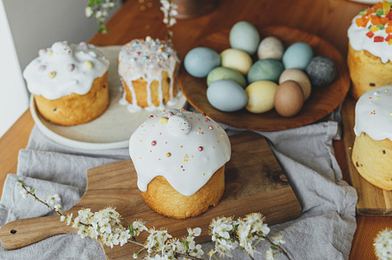 Homemade easter breads, natural dyed eggs and spring blossom on, a Holiday Photo by Sonjachni