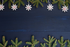 Wooden Christmas background with fir branches and snowflakes on, a Holiday Photo by ndanko