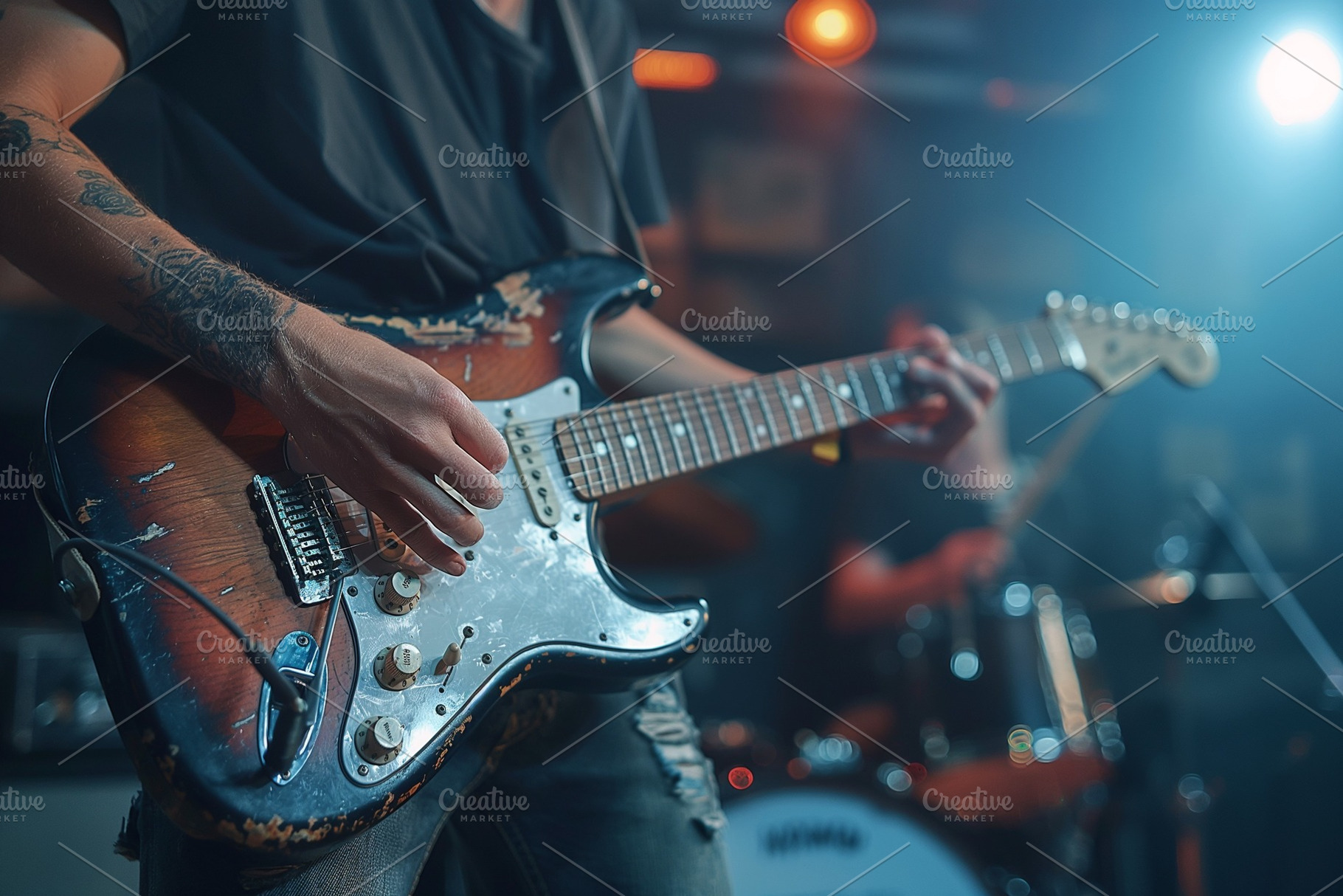 A male guitarist passionately plays his electric guitar on stage, illuminated b, a Person Photo by ImageMir