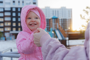 Happy child in pink jacket enjoys, a Nature Photo by darksoul72