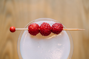 Raspberry cocktail aroma drink alcohol skewer, a Food & Drink Photo by Photo Drive Studio