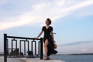 Confident woman in black dress, a Person Photo by Elena Vagengeim