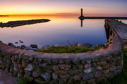 Sunset over the lake ladoga stock photo containing lighthouse and beacon, a Nature Photo by photoWorkshop