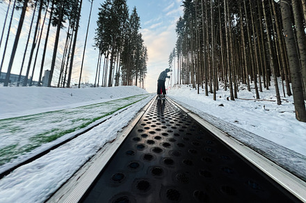 Ski Conveyor Belt in a Snowy Forest During Winter, a Photo by AS photostudio