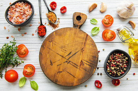 Cooking wooden utensils, empty cutting board and spices. Food co, a Food & Drink Photo by Olena Rudo