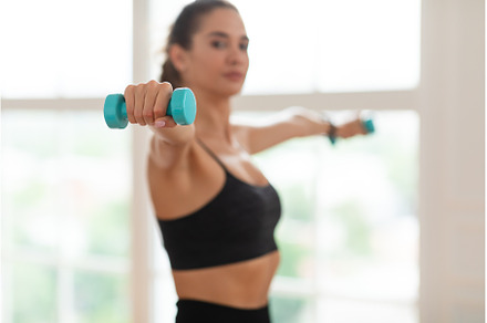 Sporty Young Woman Exercising With, a Person Photo by Prostock-Studio