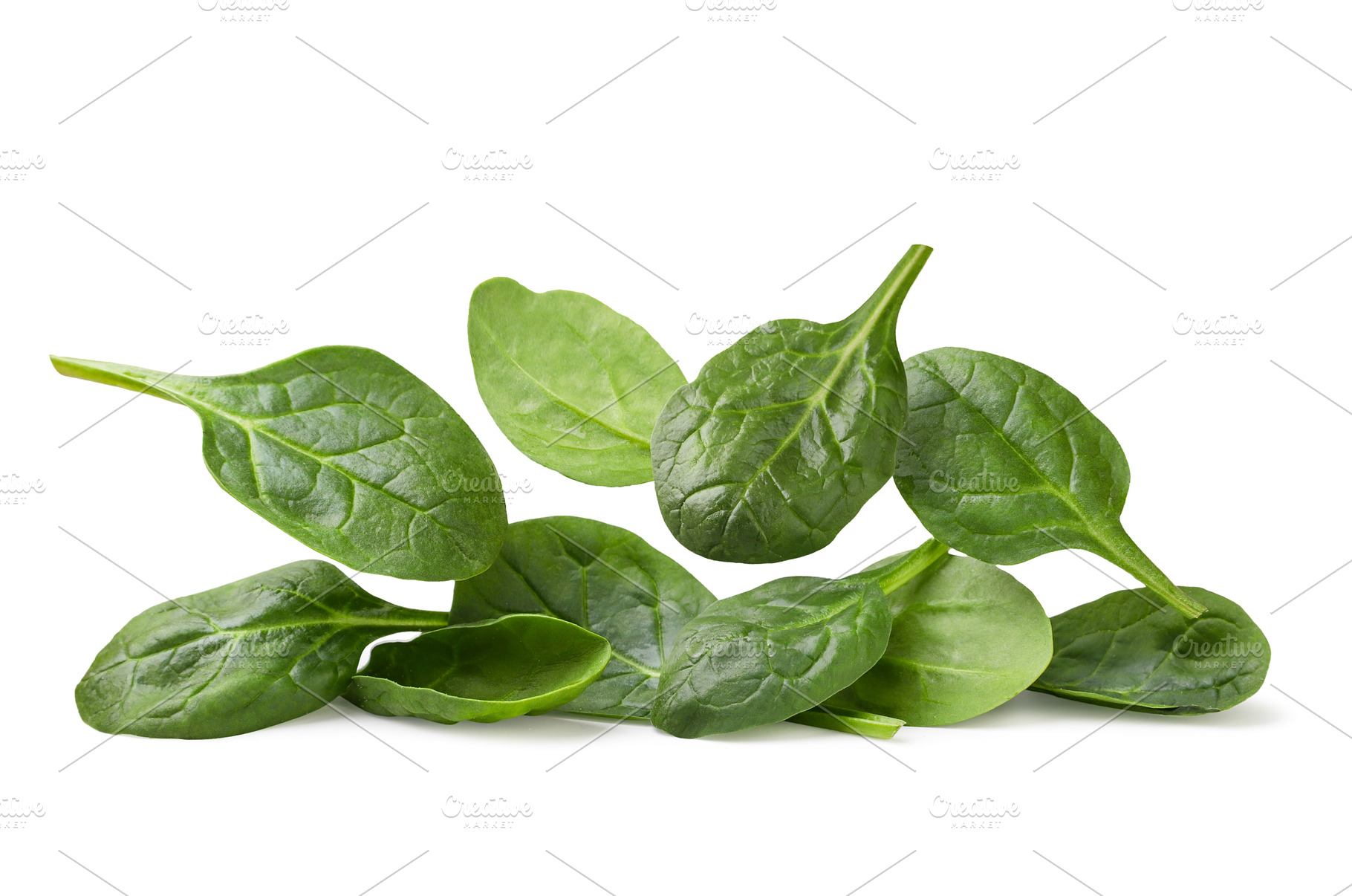 Spinach leaves falling on a pile on, a Food & Drink Photo by innakreativ