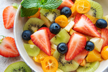 Healthy fresh fruit salad in a bowl, a Food & Drink Photo by Olena Rudo