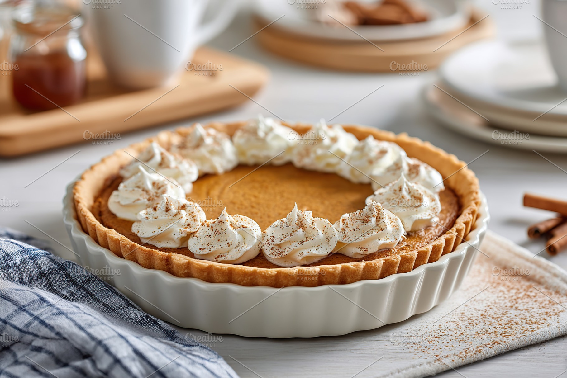 Pumpkin pie with whipped cream and cinnamon ready for dessert on a rustic dinin, a Food & Drink Photo by AlyaAnd