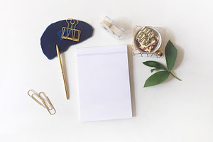 Flatlay arrangement with writing pad