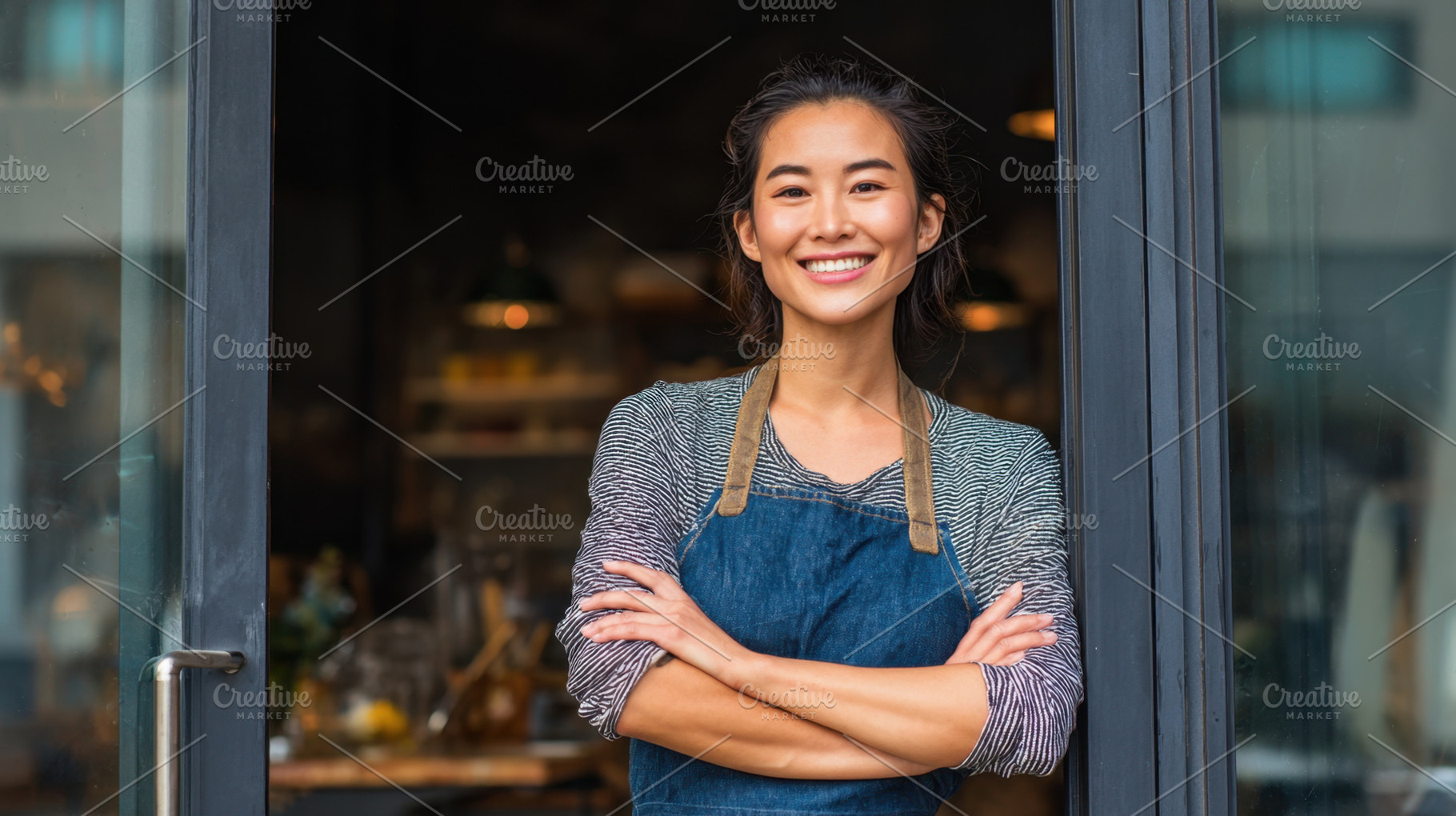 Woman stands at cafe door smiling, a Photo by Beautiful things