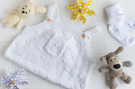 Set of white clothes and accessories for newborn baby. Knitted t, a Beauty & Fashion Photo by Olena Rudo