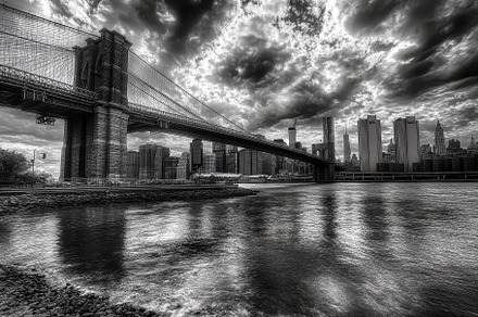 Brooklyn Bridge stretches over East, a Photo by Iftikhar Alam