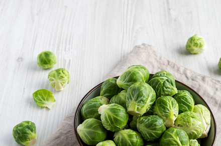 Raw Organic Brussel Sprouts in a Bowl, side view. Copy space., a Food & Drink Photo by LiudmylaChuhunova