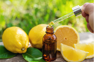 lemon essential oil in a bottle, a Beauty & Fashion Photo by yanadjana