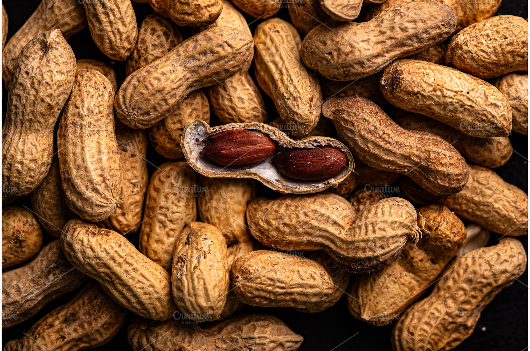 Pile of peanuts with one opened pod, a Food & Drink Photo by Yulia Furman