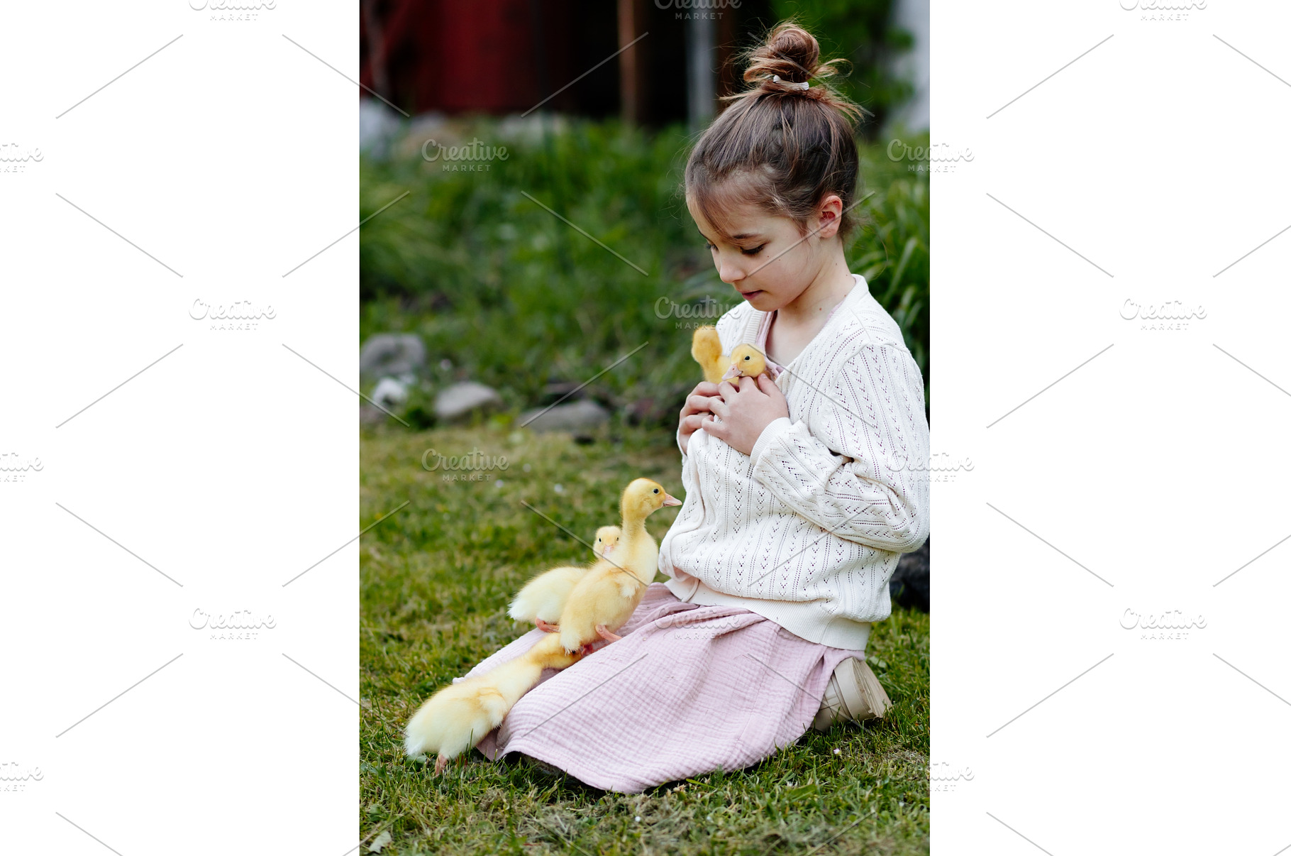Smiling child playing with baby, an Animal Photo by HalfPoint