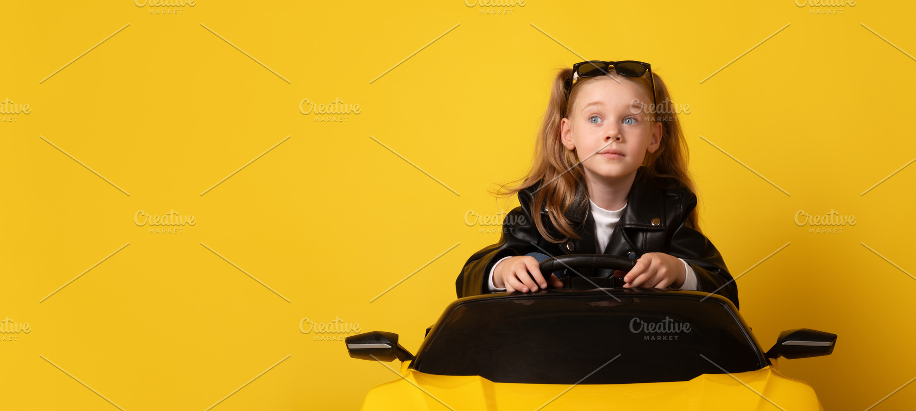 Young girl in black leather jacket and sunglasses on head sittin, a Person Photo by Ales Munt