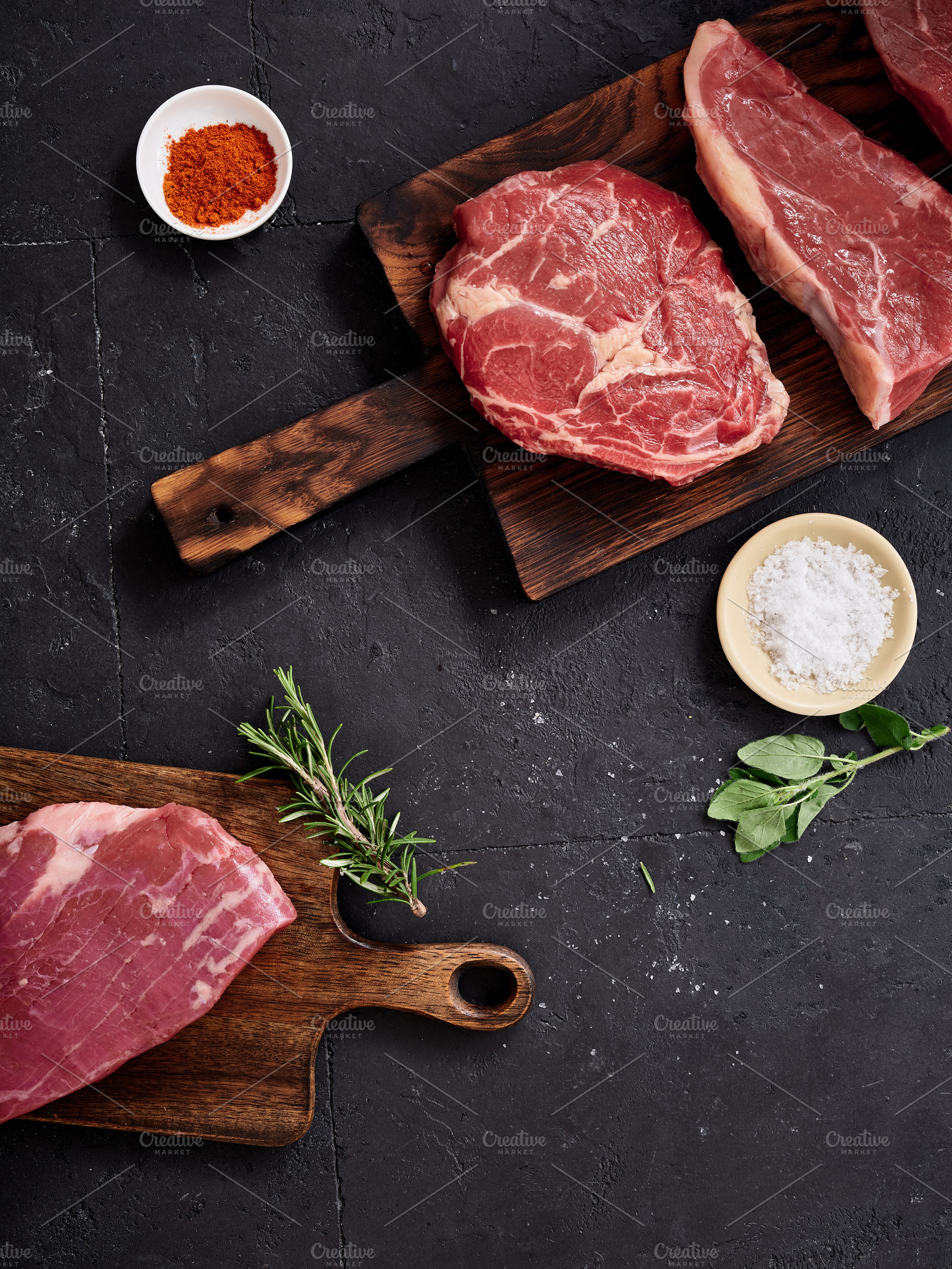 Various cuts of raw beef including rib-eye, roast beef, flank and rump steak di, a Food & Drink Photo by Asya Nurullina
