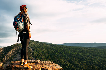 A woman in the mountains, a Person Photo by SOTNIKOV_MISHA