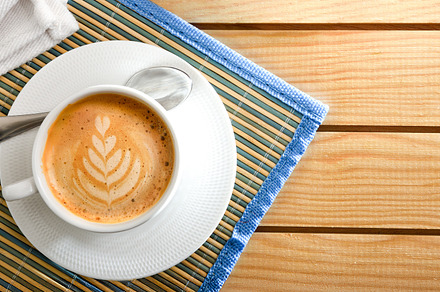 Coffee with flower drawing on wooden table top view, a Food & Drink Photo by Davizro's Market