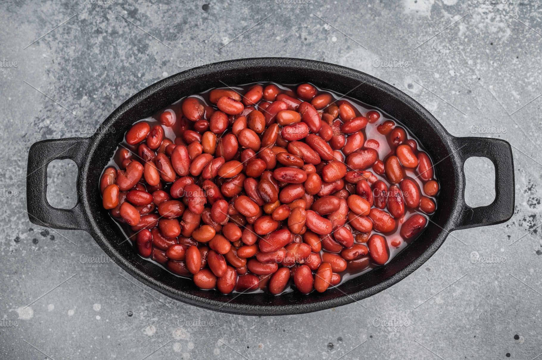Kidney beans in a cast iron skillet on a rustic wooden board. La, a Food & Drink Photo by composter-box@mail.ru